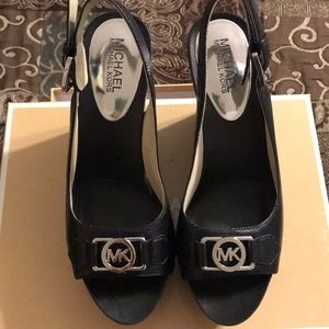 Michael Kors Charm Sling. New, never worn.
